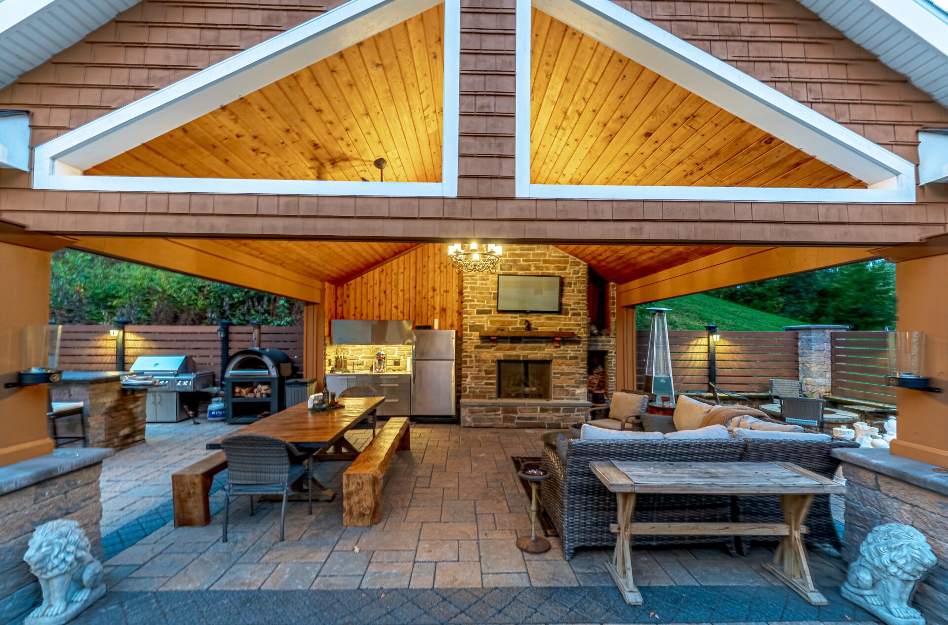 Covered patio installation with outdoor kitchen and fireplace in Southington CT