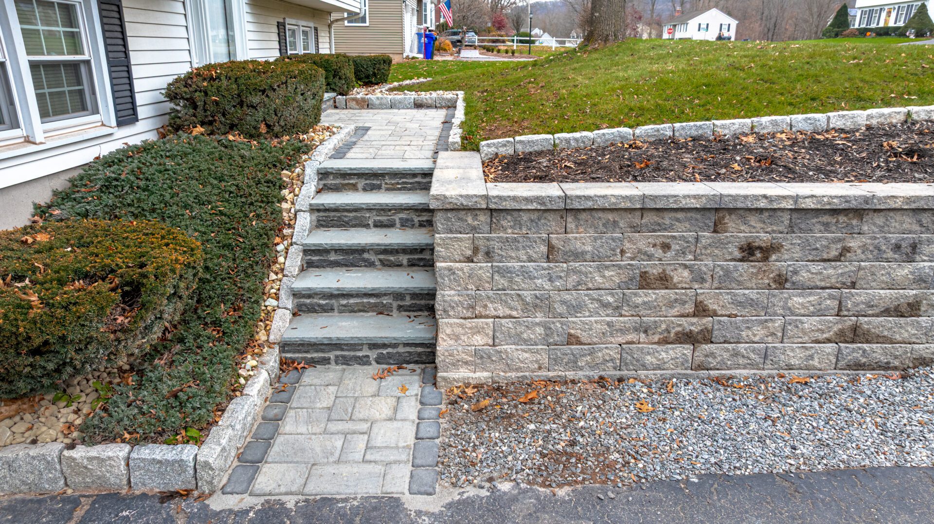 Professional stone stairs and retaining wall installation in Cheshire, CT by HQ Landscaping